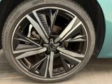 a close up view of a car ' s wheel and tire