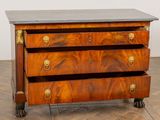 a small chest of drawers on wheels on a wooden floor