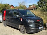 a black van that is parked on the side of the road
