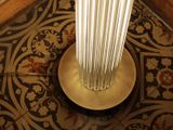 a lamp that is sitting on a table in a room