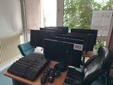 a computer desk with a keyboard and a monitor on it