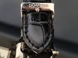 a close up of a watch on a table
