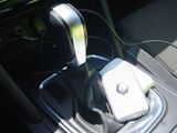 an image of a car ' s interior with a car charger plugged into the center console