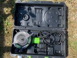 an open tool box sitting on top of a grass covered field