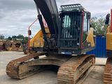 two excavators that are sitting in the dirt