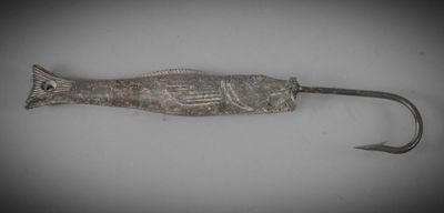 a fish shaped fishing hook with a hook on it