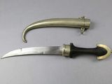 two knives that are laying next to each other on a table