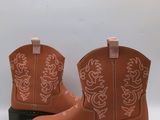 a close up of a pair of children ' s boots on a white background