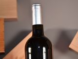 a bottle of wine that is sitting on a table