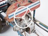 a small toy car with a steering and a steering wheel