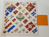 an image of a square scarf with flags and a box on a table