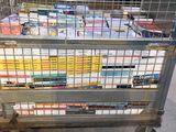 a metal cart with many books on top of it