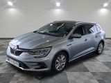 a grey car parked in a room with a checkered floor