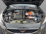 a car with its hood open and the engine in the back