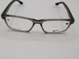 a pair of glasses sitting on top of a white table
