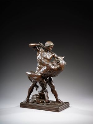 a bronze statue of a man and woman on a horse