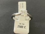 a close up of a ring with a diamond on top of it