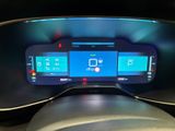 the dashboard of a car with a digital display on it
