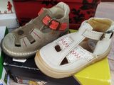 many pairs of shoes that are on top of a box