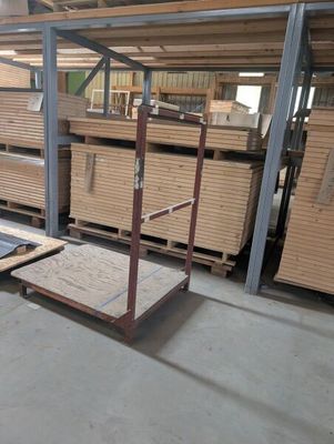 several pallets of wood are stacked on pallets in a warehouse