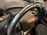 a close up of a steering wheel in a car