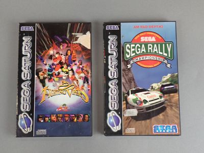 the two video games are on the table next to each other