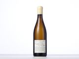 the bottle of white wine is sitting on the table