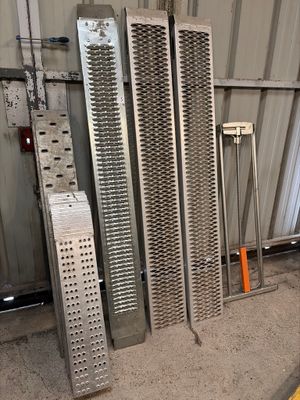 a pile of metal grates sitting in a warehouse