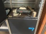 a black cabinet with a blow dryer on top of it