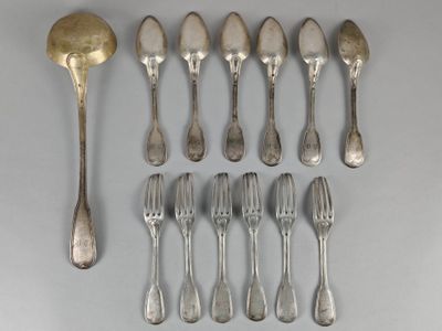 a lot of silver spoons and forks on the table