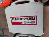 a white toilet with a red and black sticker on it