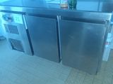 a stainless steel counter with a bottle on top of it