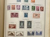 an open book with a bunch of different stamps on it