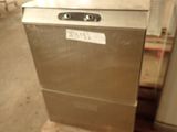 a silver dishwasher sitting on a pallet in a warehouse