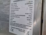 a sign on the side of a machine that says ice maker