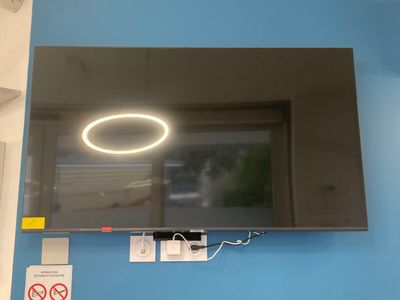 a flat screen tv mounted on a wall in a room