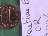 a penny sitting on top of a piece of paper with a note attached to it