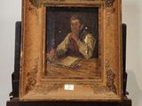 tableau représentant un homme en train de lire un livre posé sur un chevalet en bois