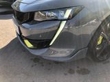a picture of a car that has been dented and is parked in a parking lot