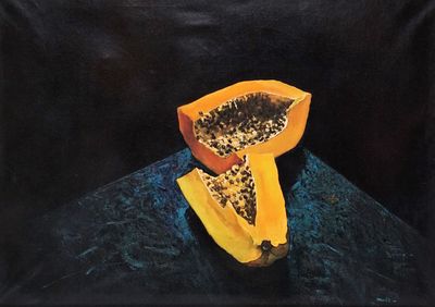 une peinture représentant un fruit posé sur une table