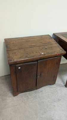 two wooden tables with drawers on them in a room
