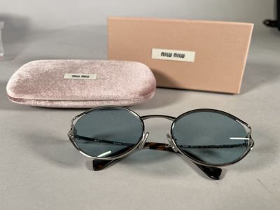 the sunglasses are sitting on the table next to the case