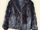 a picture of a fur coat on a hanger