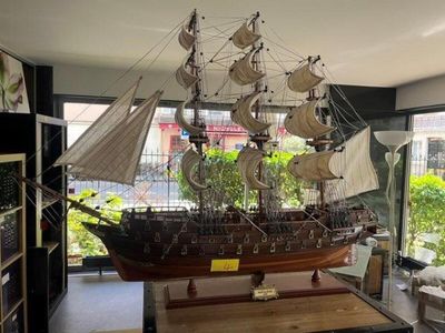 a model of a ship that is on display in a room