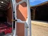 a white van with a red bed in the back of it