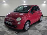 a picture of a small red car parked in a garage
