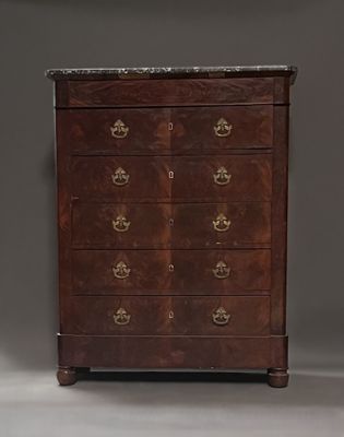 an antique chest of drawers with marble top and brass handles