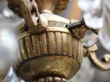 a close up view of a chandelier made of brass