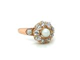 an image of a white pearl and diamond ring on a white background