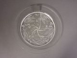 a glass plate with a design on it on a table